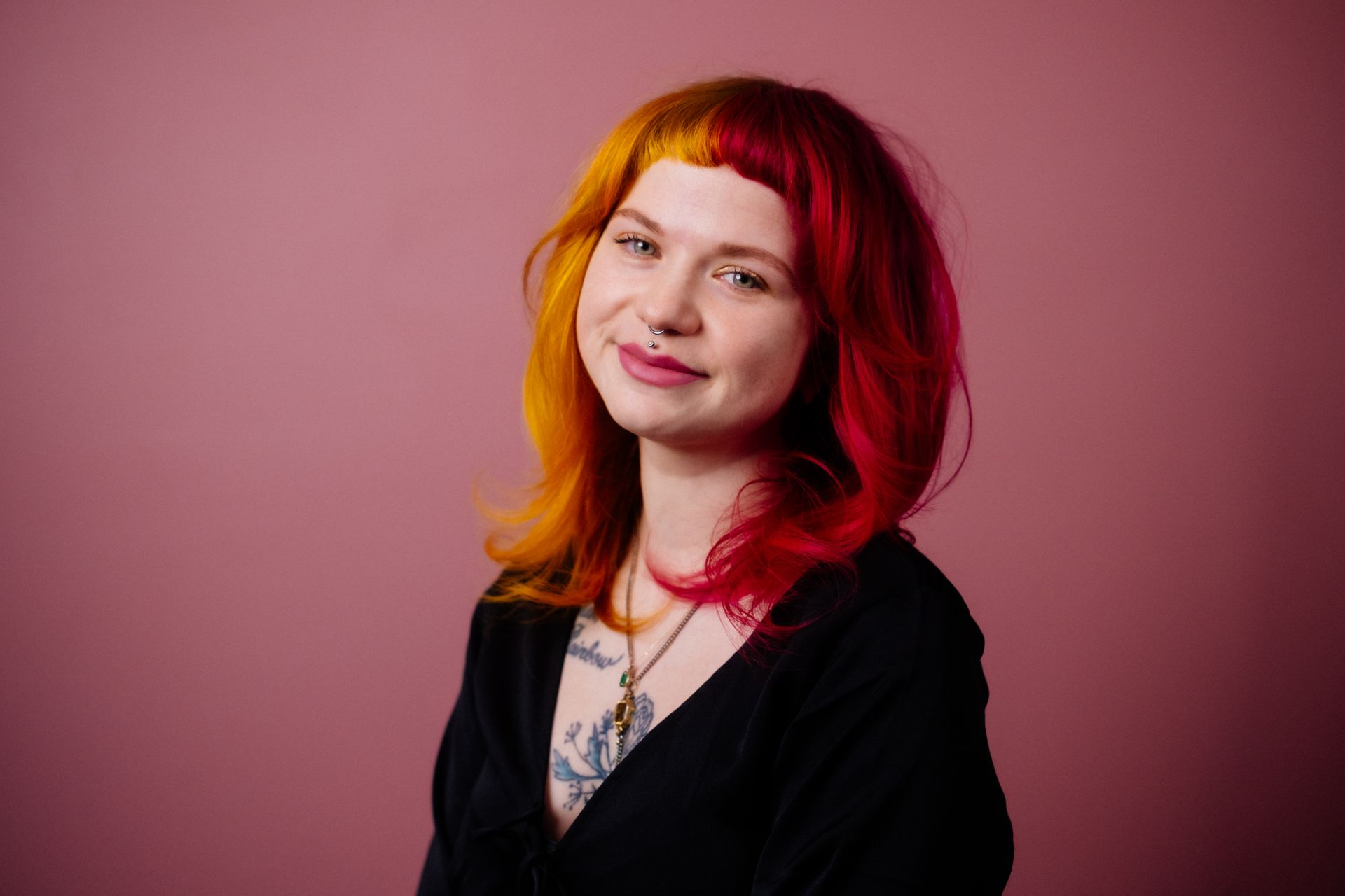 Emma, Owner, and colour wizard at Collective Haus smiling into the camera.