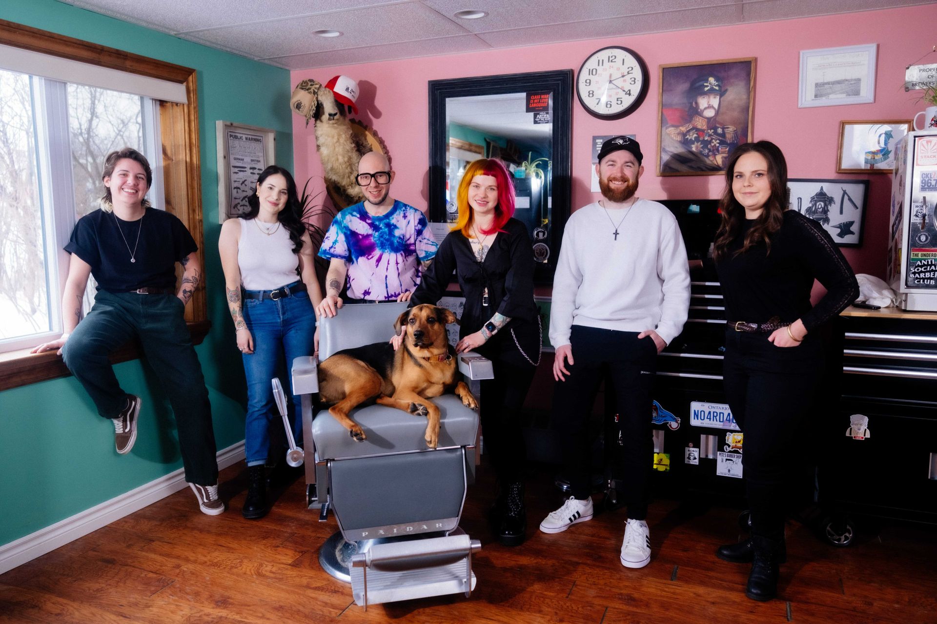 The Collective Haus gang huddles around Marge for a team profile photo.