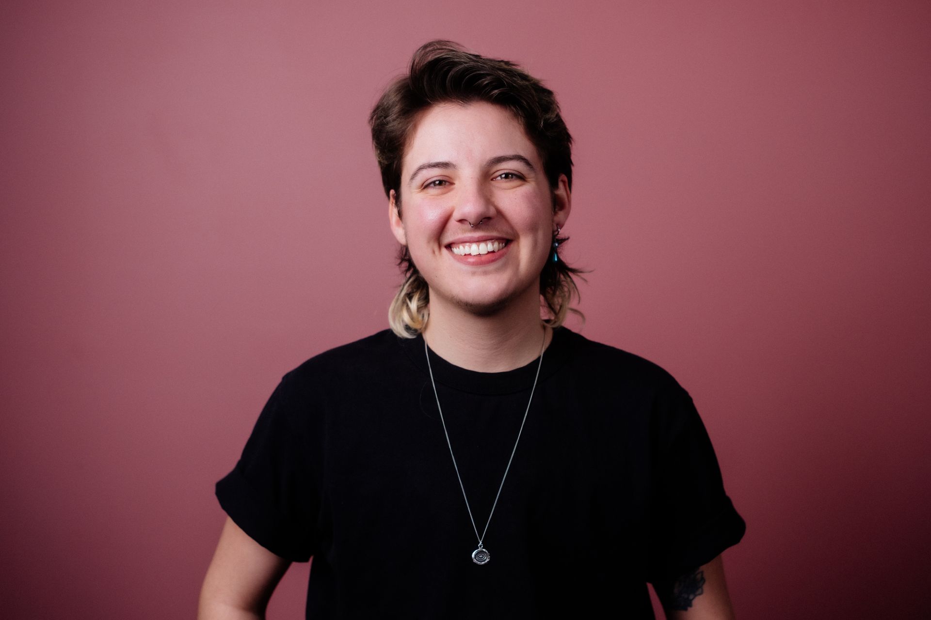 Andy, the apprentice barber smiles confidently.