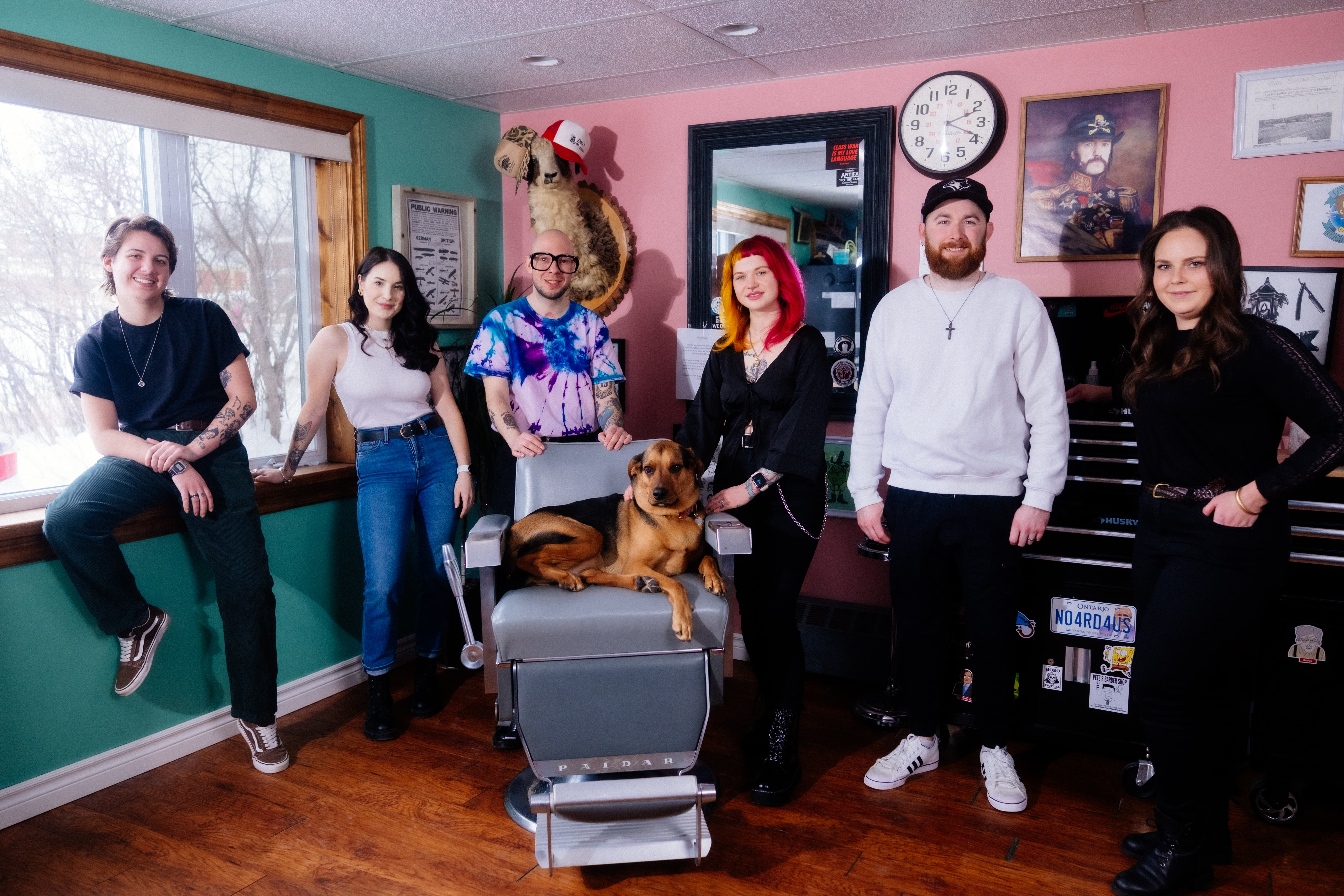 The Collective Haus crew of barbers and stylists hanging out in the barbershop.